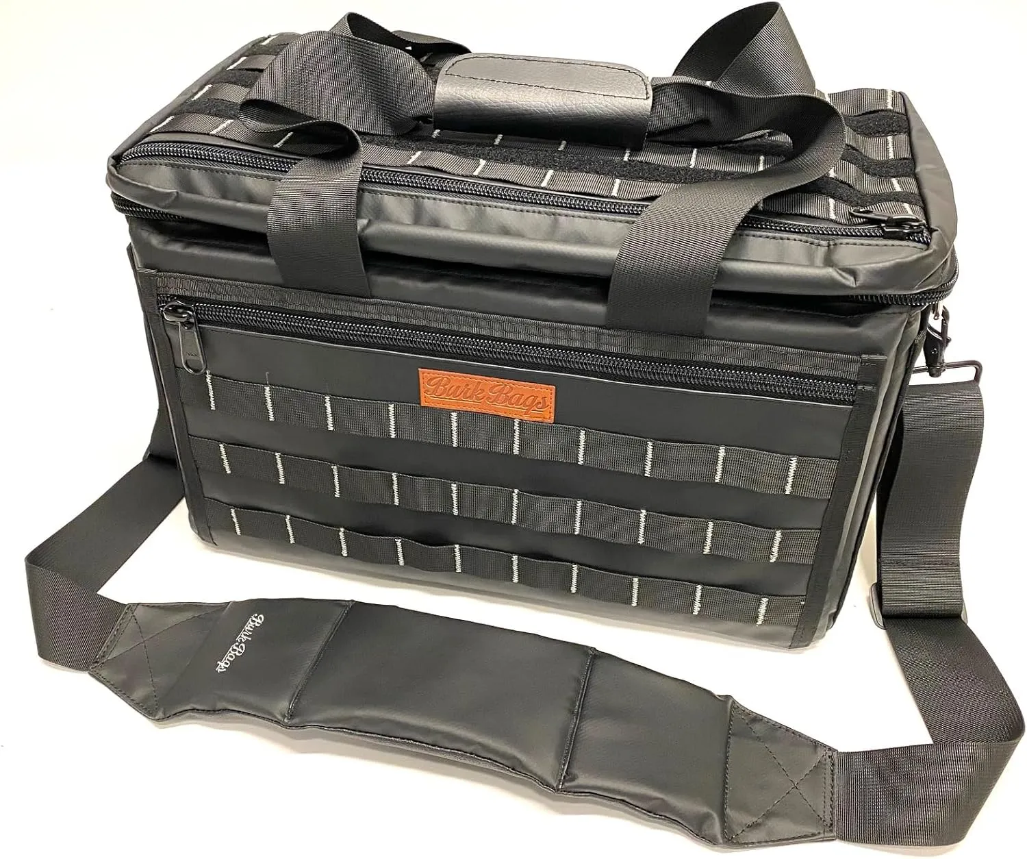 Camera Bag for Photographers and Videographers. Solid and rigid walls, spacious and perfect for cinema, still, and video equipment. Molle webbing and hook and loop to attach other pouches.